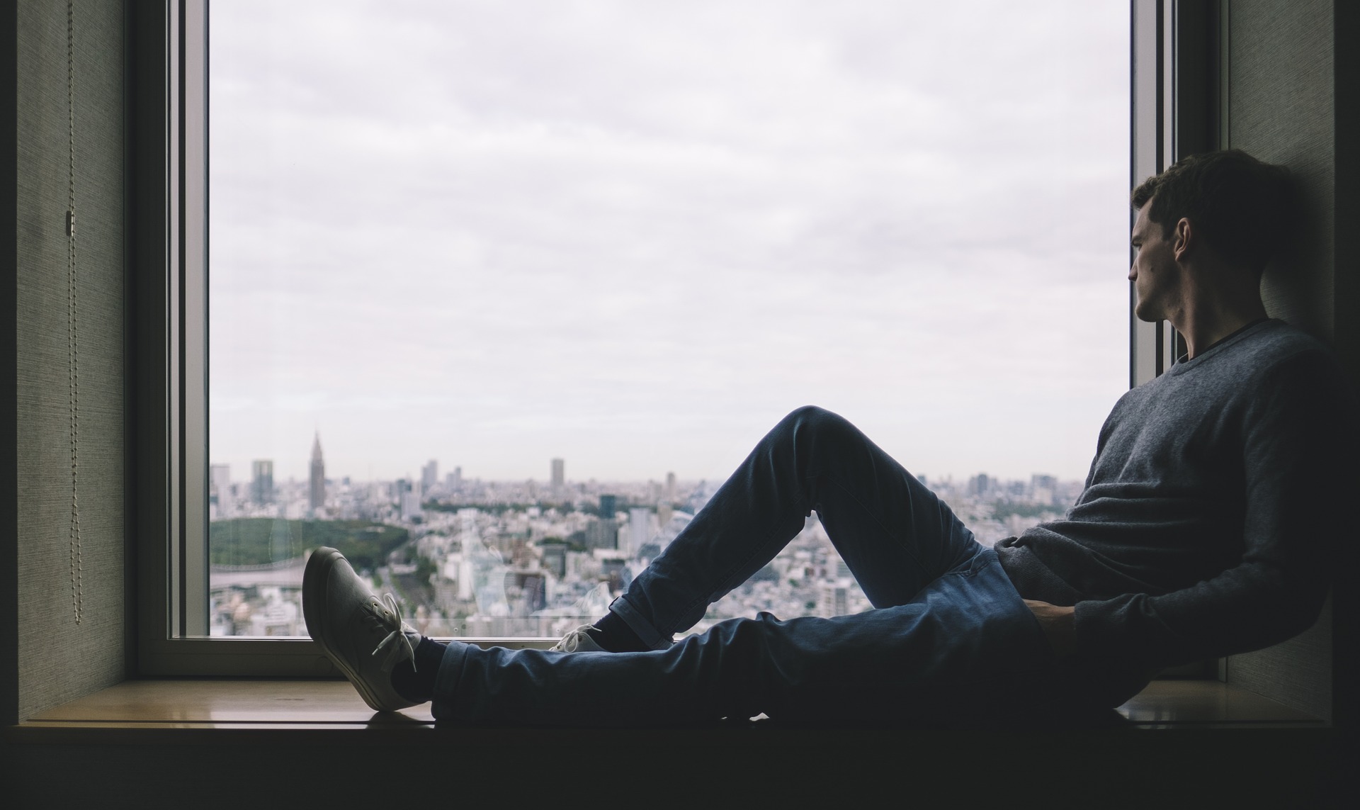 Introspective alone window guy